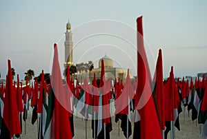 UAE flags in national day with a mosque in the background