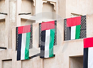 UAE flags on traditional house