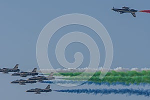 UAE Largest Military Union Fortress 7 Show in Umm al Quwain with coordinated military aircrafts showing the UAE flag colors on the photo