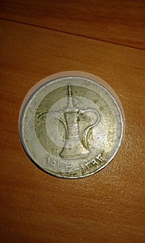 uae(united arab emirates )coin with cultural symbol