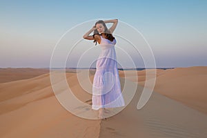 UAE. Woman in desert