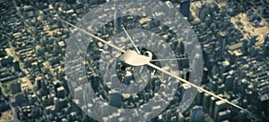 UAV armed reconnaissance and attack drone flying high above a metropolitan city. photo
