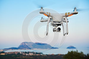 Uav drone with digital camera hover sea island