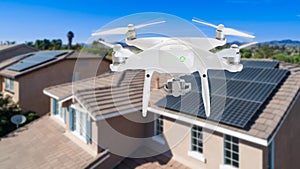 UAV Drone Inspecting Solar Panels On Large House