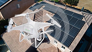 UAV Drone Inspecting Solar Panels On Large House