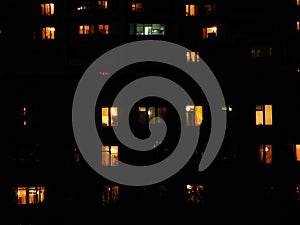 Ubban town windows at night. House building lights