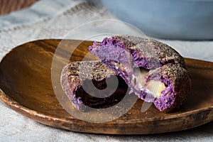 Ube cheese pandesal, a gourmet pandesal that has a filling of ube and cheese combination