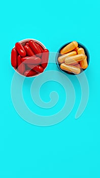 Ubiquinol coQ10 coenzyme q10 supplement softgels and b-complex multivitamin supplement capsules on turquoise background. dietary photo