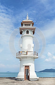 Ublic white lighthouse on pier of Bang Bao fishing village at Koh Chang Island,Trat, Thailand