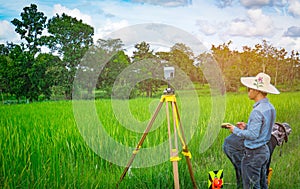 UBONRATCHATHANI, THAILAND-SEPTEMBER 26, 2017 : Asian smart engineer or surveyor is working on controller screen for surveying land