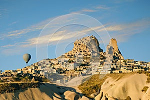 Uchisar castle in the sunrise. Cappadocia