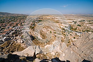 Uchisar Castle. Tourist at the top of the fortress, mountains, view of Cappadocia. Traveler at Destinaton. Turkey Vacation and