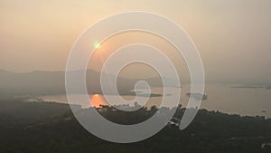 Udaipur, India, November 2019 - A sign in front of a sunset