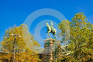 Uestrian Statue of Kaiser Wilhelm II monument on stone pedestal near Hohenzollern bridge in Cologne photo