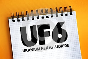 UF6 - uranium hexafluoride acronym text on notepad, technology concept background