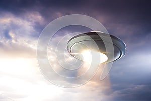 UFO with abduction beam flying in the sky