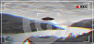 UFO, alien and camcorder viewfinder with a spaceship flying in the sky over area 51 for an invasion. Camera, spacecraft
