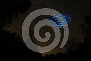 UFO Flying through a Star Filled Sky