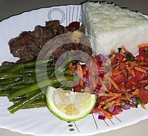 Ugali, deepfried beef, french beans and salad