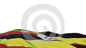 Uganda fabric flag waving on the wind loop. Uganda embroidery stiched cloth banner swaying on the breeze. Half-filled white