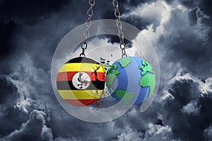 Uganda flag ball smashing into planet earth. Global impact and disaster concept. 3D Render
