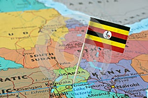 Uganda flag on a map