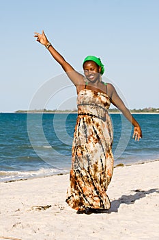 Uganda woman enjoys the beach