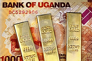 Ugandan 1000 shilling bank note with three gold bars