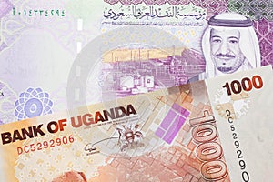 Ugandan currency paired with money from Saudi Arabia