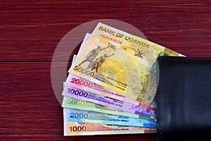 Ugandan Shilling in the black wallet