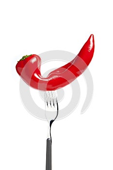 Ugly vegetables. Red pepper on a fork photo