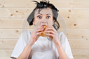 Ugly woman eating a burger