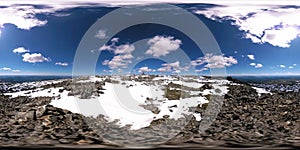 UHD 4K 360 VR timelapse of snowy mount top. The sunlight on the peak and ice landscape. Winter frozen rocks