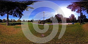 UHD 4K 360 VR Virtual Reality of a city park recreation area. Trees and green grass at autumn or summer day