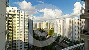 UHD 4k movie of moving clouds and blue sky over apartment buildings in Punggol in Singapore