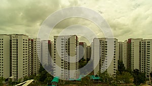 UHD 4k movie of moving clouds over apartment buildings in Punggol in Singapore