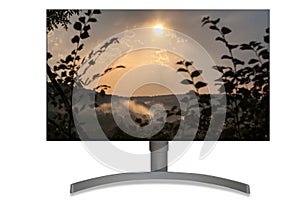 UHD monitor with sea and mountains image on it