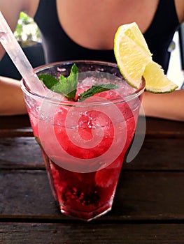 Uherske Hradiste, czech republic, 06.21.2021 Close-up view of a dewy glass full of mojito in a restaurant garden on a summer day,