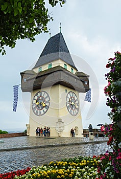 Uhrturm, Clock tower of Graz in spring on rainy and cloudy day, Austria.