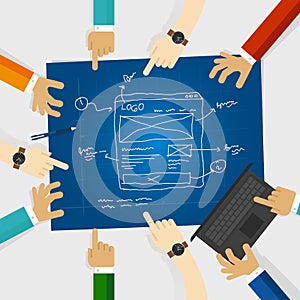 UI or user interface and UX or user experience design team work on wireframe website in blue print