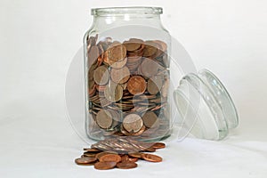 UK coins kept on a old savings jar