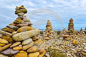 Uk coloured towers by the sea laid by people