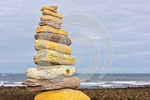 Uk coloured towers by the sea laid by people