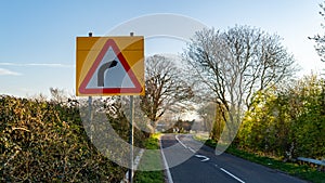 A UK Country road turns sharply to the right