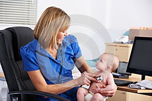 UK doctor examining baby