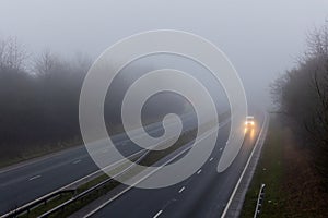 UK dual carriageway with little traffic in fog