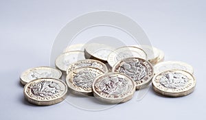 UK money, new pound coins in small pile photo