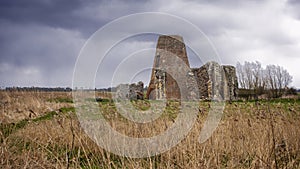 St Benet`s Abbey gatehouse and mill on the Norfolk Broads during a winter storm