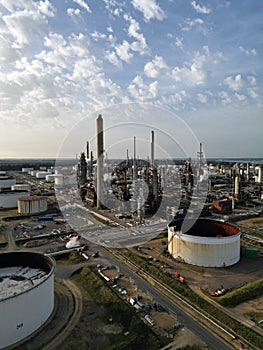 UK petrochemical complex with chimneys and oil storage tanks