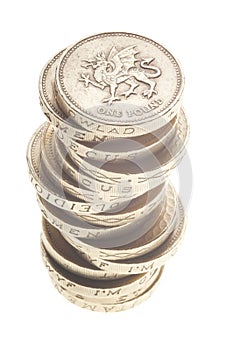 UK Pound coin currency stack on white background. British money coins isolated on white